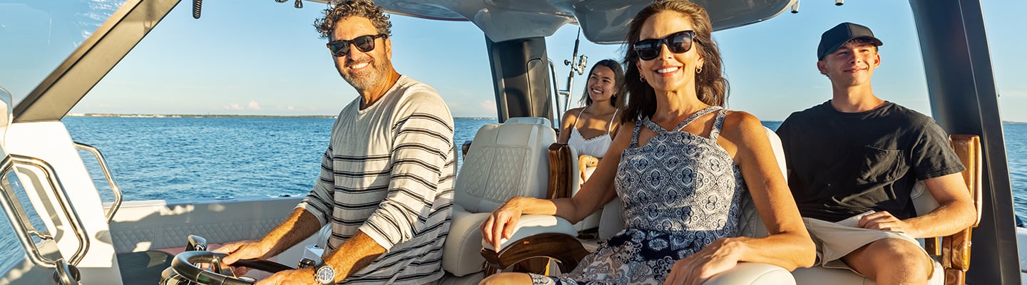 group of people sitting on Aquila Power Catamaran