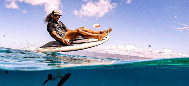 Person riding on an e-foil board